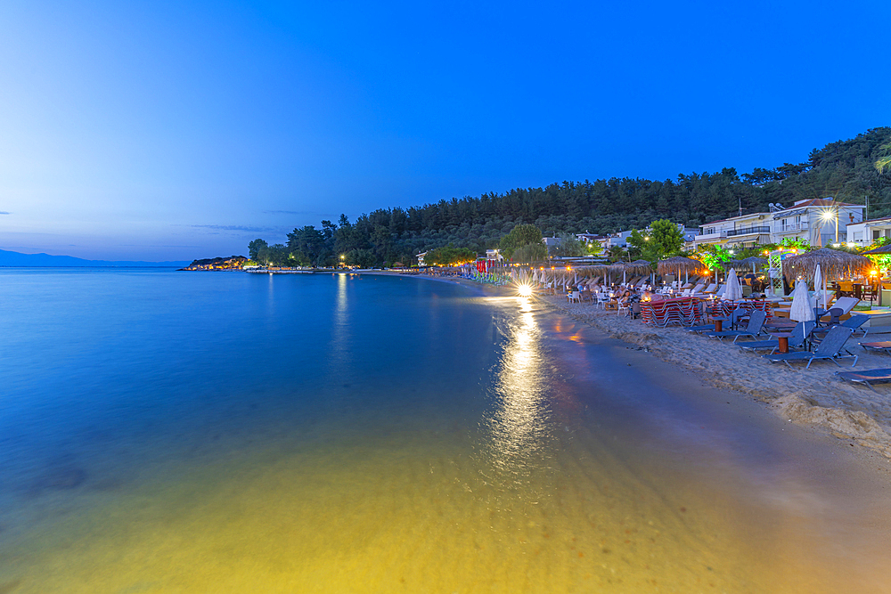 View of restaurant on beach at dusk, Thassos Town, Thassos, Aegean Sea, Greek Islands, Greece, Europe