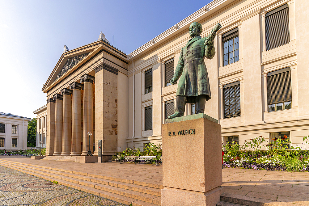 View of Peter Andreas Munch statue and Domus Media in University Square, Oslo, Norway, Scandinavia, Europe