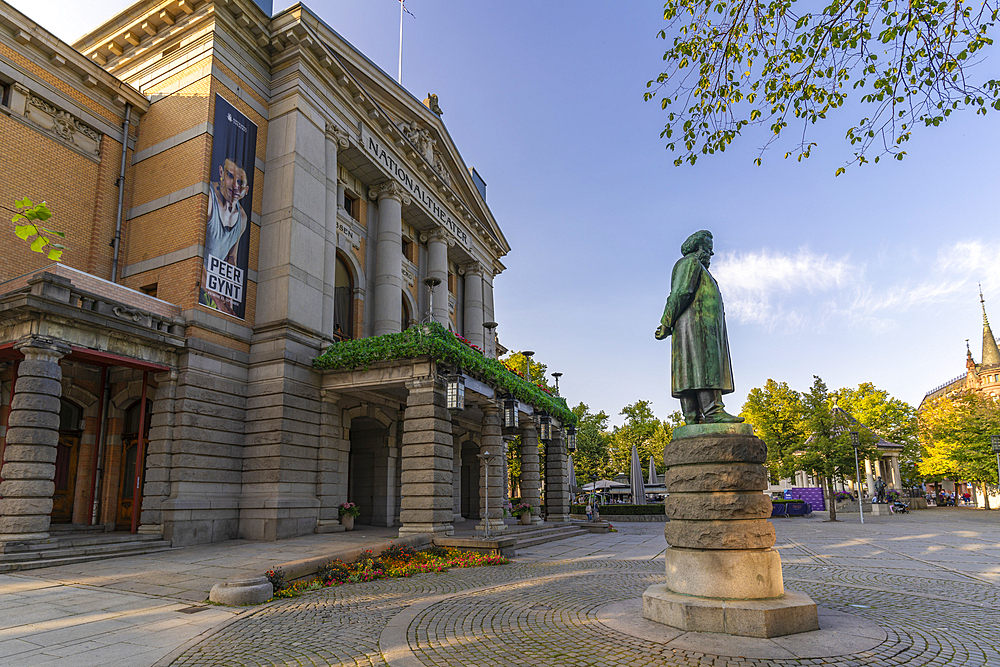 View of Henrik Ibsen statue and the entrance of the National Theatre from Stortingsparken, Oslo, Norway, Scandinavia, Europe