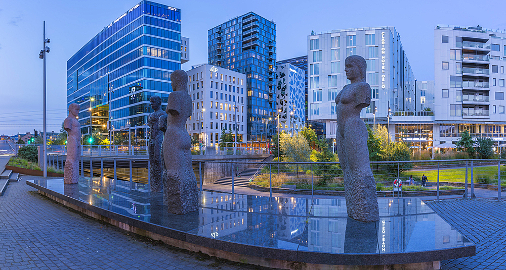 View of the Barcode buildings and Fellesskap sculptures at dusk, Oslo, Norway, Scandinavia, Europe