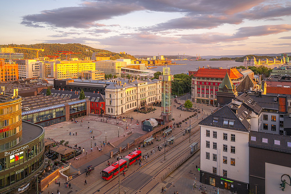 View of Jernbanetorget and city skyline from elevated position at sunset, Oslo, Norway, Scandinavia, Europe