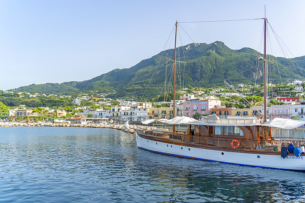 View of sailboat and town of Lacco Ameno, Island of Ischia, Campania, Italy, Europe