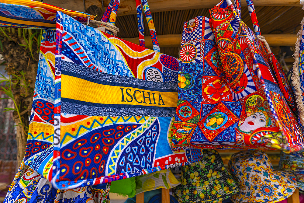 View of colourful bags in shop near Aragonese Castle, Port of Ischia, Island of Ischia, Campania, Italy, Europe