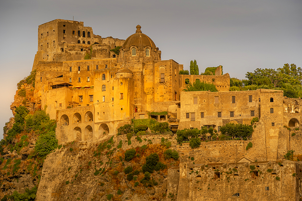 View of Aragonese Castle at sunset, Port of Ischia, Island of Ischia, Campania, Italy, Europe