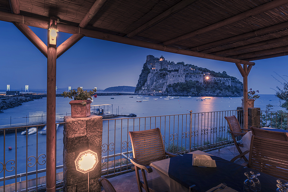 View of Aragonese Castle at dusk, Port of Ischia, Island of Ischia, Campania, Italy, Europe