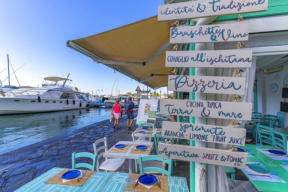 View of boats and restaurants in Porto d'Ischia (Port of Ischia), Island of Ischia, Campania, Italy, Europe