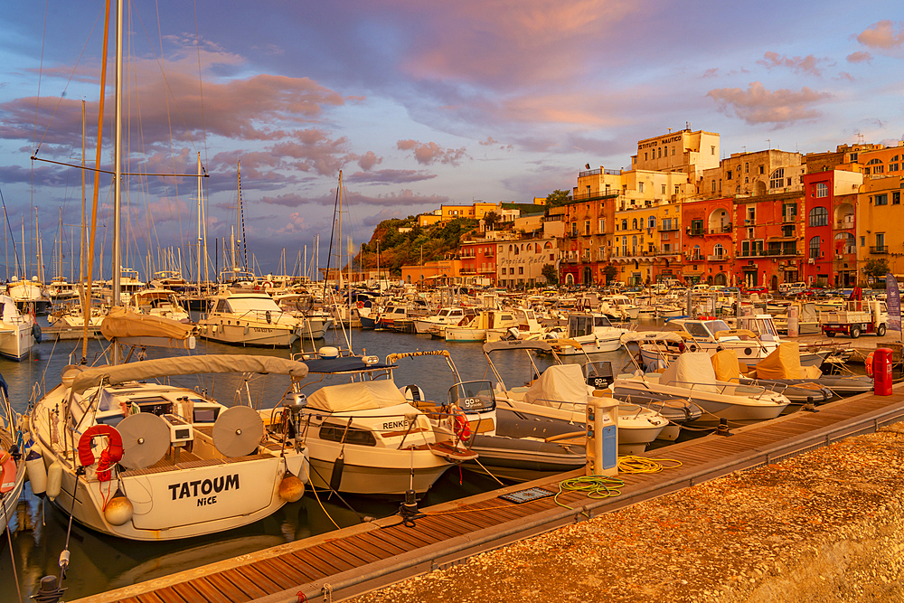 View of the fishing port Marina Grande with boats at golden hour, Procida, Phlegraean Islands, Gulf of Naples, Campania, Southern Italy, Italy, Europe