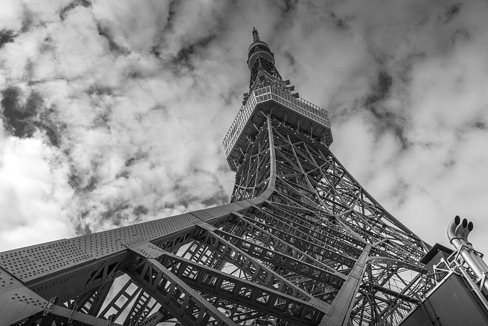 View of Tokyo Tower from its base against cloudy sky, Shibakoen, Minato City, Tokyo, Honshu, Japan