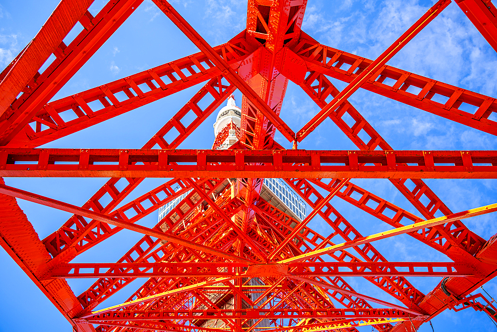 View of Tokyo Tower from its base against blue sky, Shibakoen, Minato City, Tokyo, Honshu, Japan