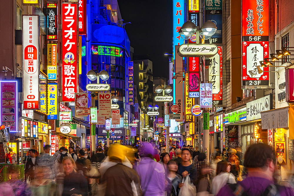 View of busy street and neon lights at night in Shibuya District, Kamiyamacho, Shibuya City, Tokyo, Japan, Asia