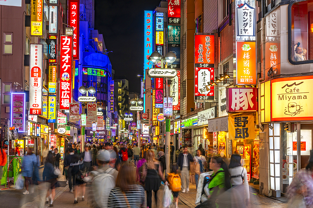 View of busy street and neon lights at night in Shibuya District, Kamiyamacho, Shibuya City, Tokyo, Honshu, Japan