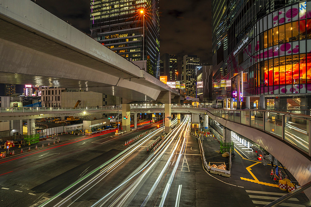 View of buildings and trail lights around Shibuya Station area at night, Shibuya District, Kamiyamacho, Shibuya City, Tokyo, Japan, Asia