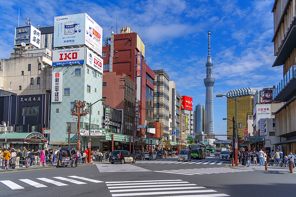 View of colourful shops and buildings with Tokyo Skytree visible in background, Asakusa, Taito City, Tokyo, Honshu, Japan