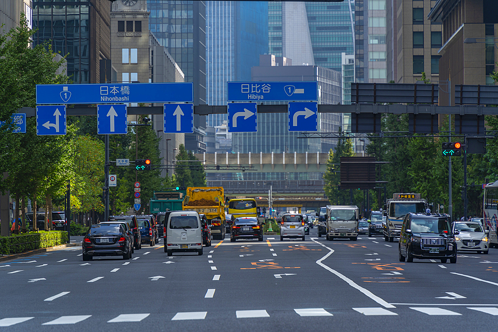 View of traffic on city street near Imperial Palace on a sunny day, Chiyoda, Tokyo, Honshu, Japan