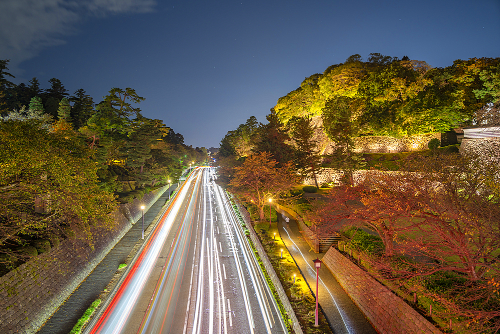 Trail lights on road by Nezumita-mon Gate, entrance to Kanazawa Castle and Park at dusk, Kanazawa City, Ishikawa Prefecture, Honshu, Japan