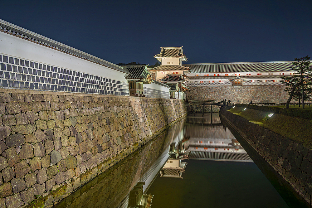 View of Gojikken Nagaya - Kanazawa castle reflecting in moat at dusk, Kanazawa City, Ishikawa Prefecture, Honshu, Japan, Asia