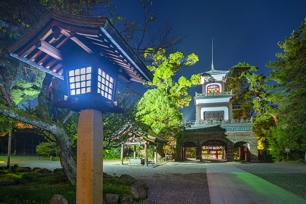 View of Oyama Shrine Shinmon Gate illuminated at dusk, Kanazawa City, Ishikawa Prefecture, Honshu, Japan