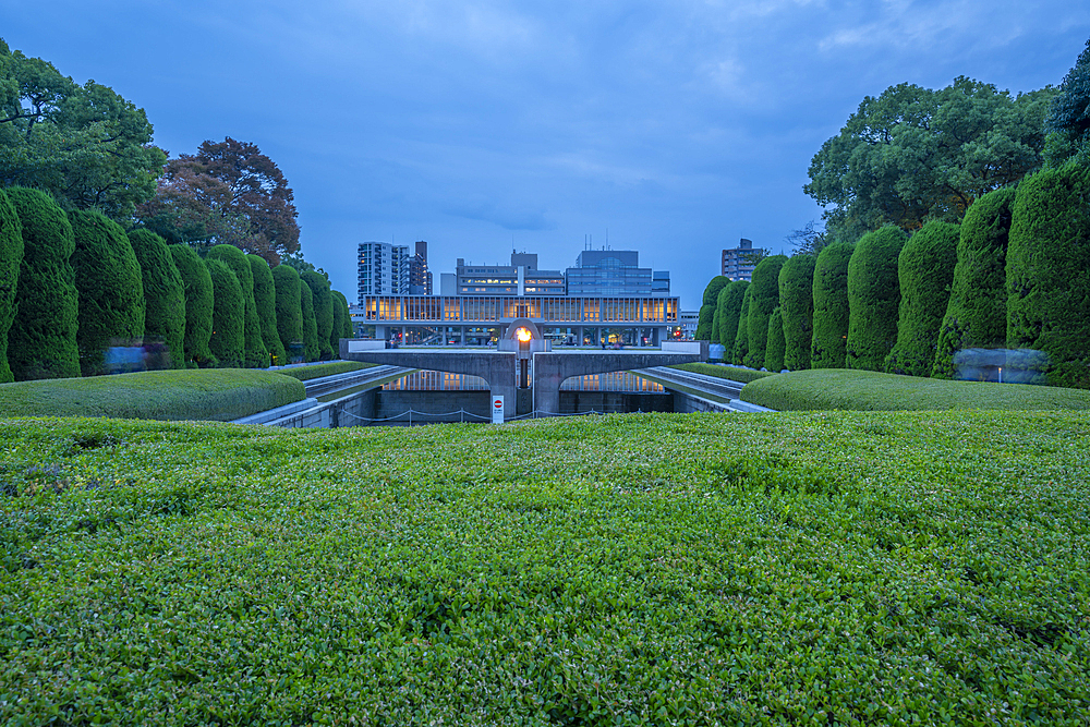 View of the Hiroshima Victims Memorial Cenotaph in the Pond of Peace, Hiroshima Peace Memorial, UNESCO, Hiroshima, Honshu, Japan