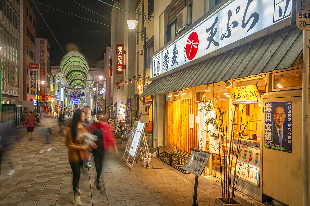 View of street scene and Japanese restaurant at night, Hiroshima, Honshu, Japan, Asia