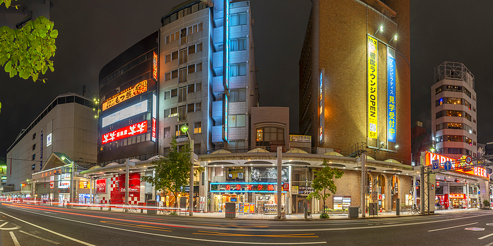 View of street scene and shops in Hiroshima at night, Hiroshima, Honshu, Japan