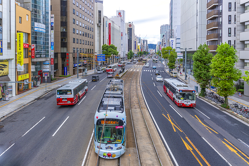 Elevated view of traffic and tram on major street during daytime, Hondori, Naka Ward, Hiroshima, Honshu, Japan