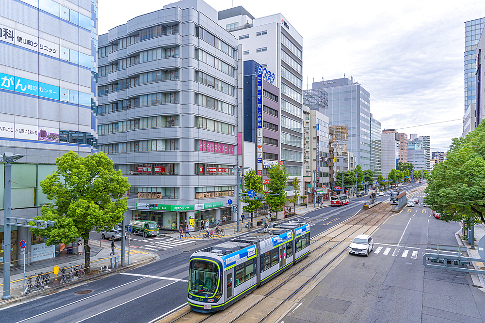 Elevated view of traffic and tram on major street during daytime, Hondori, Naka Ward, Hiroshima, Honshu, Japan