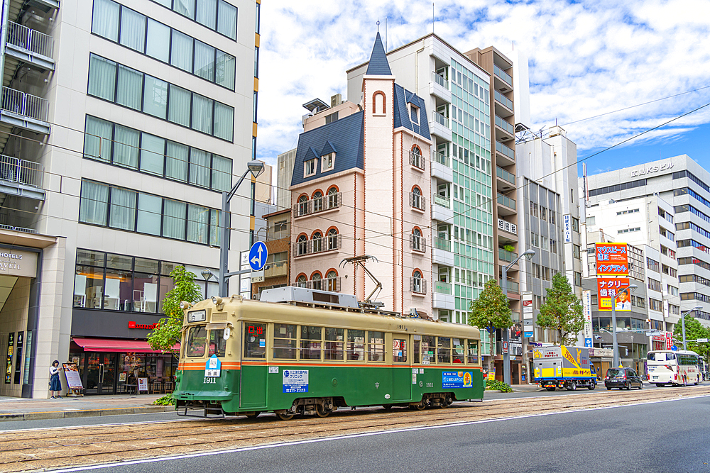 View of city tram on major street during daytime, Hondori, Naka Ward, Hiroshima, Honshu, Japan