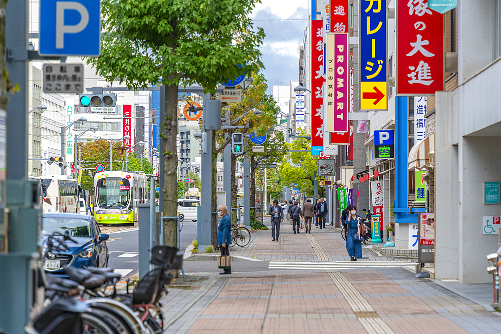 View of city tram on major street during daytime, Hondori, Naka Ward, Hiroshima, Honshu, Japan