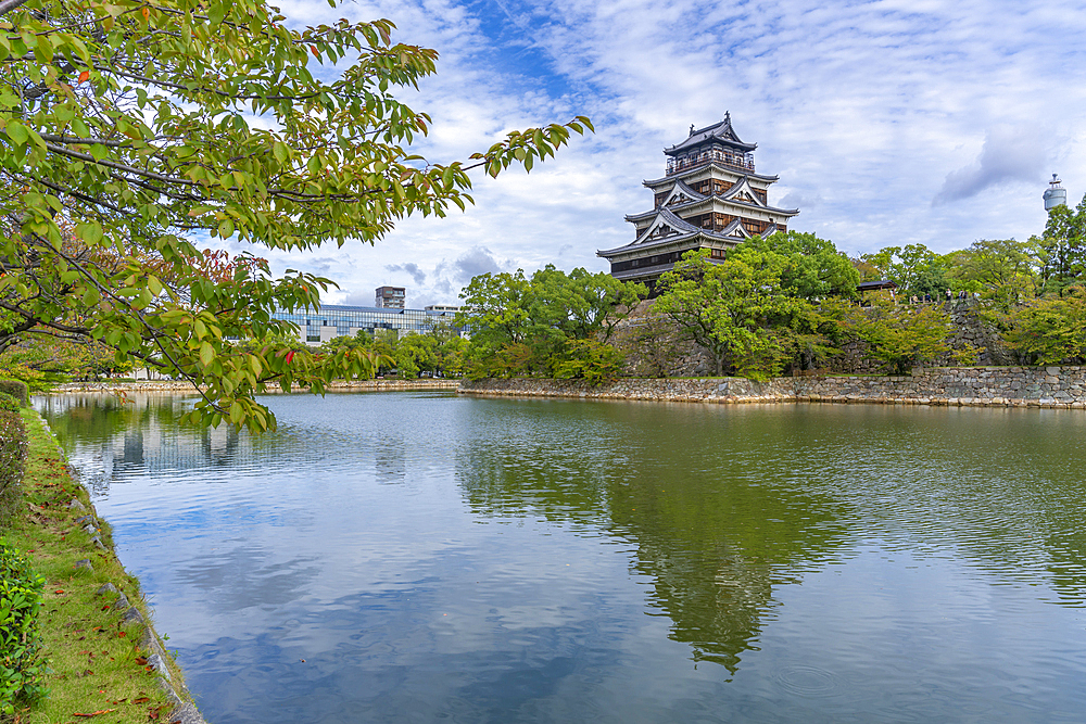 View of Hiroshima Castle, with museum, reflecting in Moat, Motomachi, Naka Ward, Hiroshima, Japan, Asia