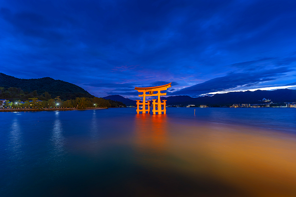 View of Itsukushima Jinja, 16th-century Shinto shrine, iconic orange gate thatthat appears to float at high tide, Miyajimacho, Hatsukaichi, Hiroshima, Japan, Asia