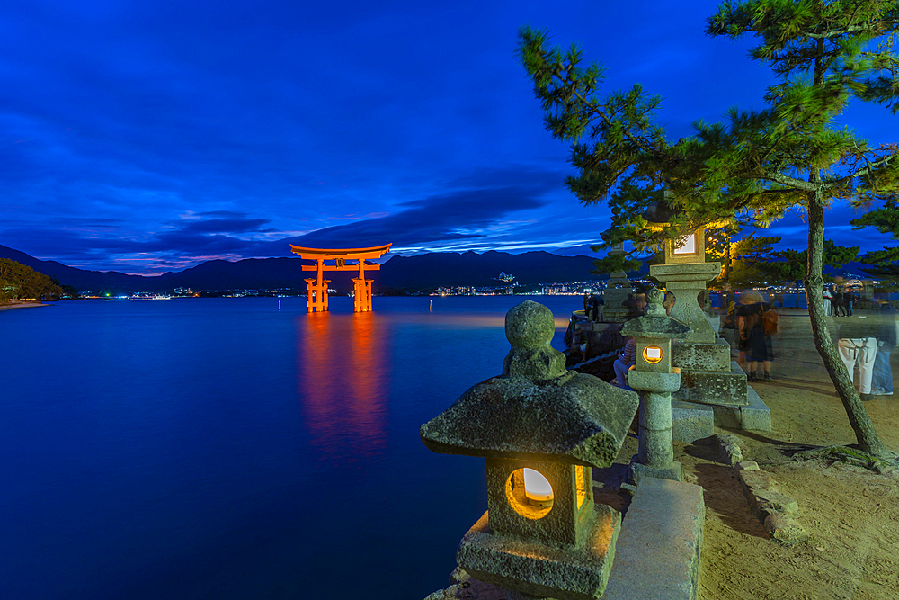 View of Itsukushima Jinja, 16th-century Shinto shrine, iconic orange gate thatthat appears to float at high tide, Miyajimacho, Hatsukaichi, Hiroshima, Japan, Asia