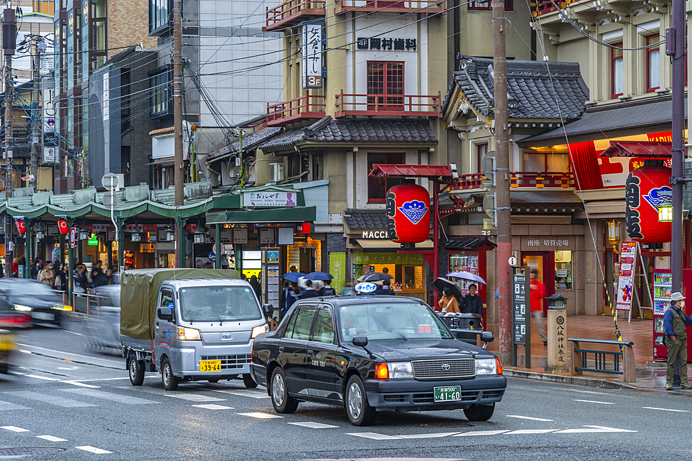 View of busy street in the Gion District, Kyoto, Kansai, Honshu, Japan