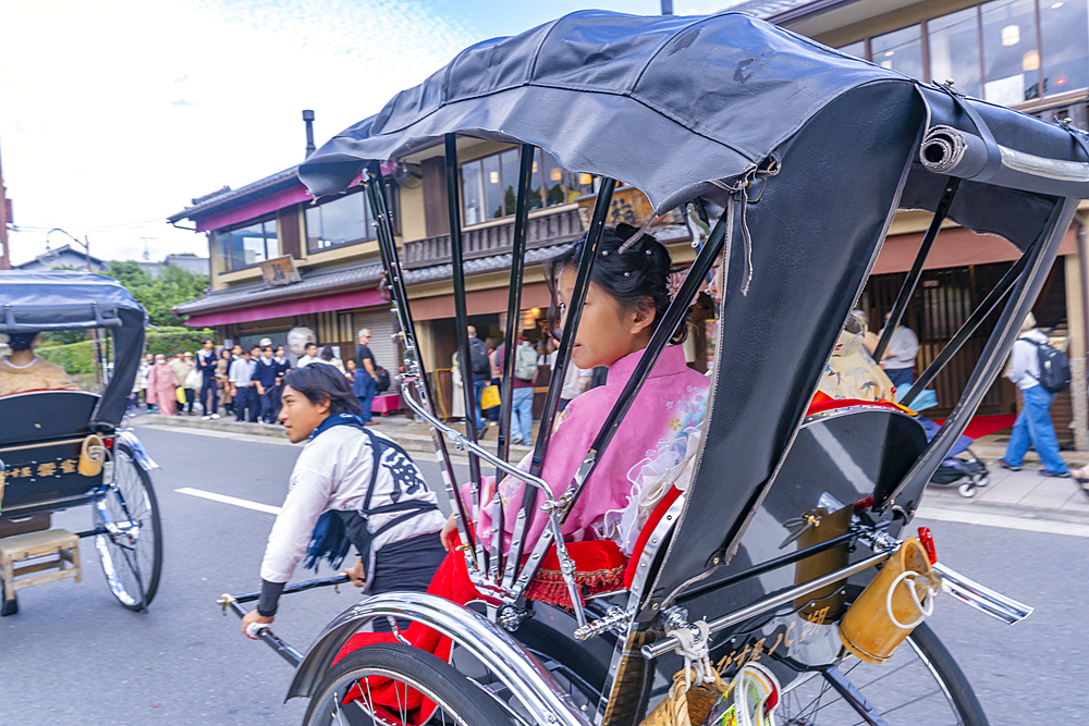 View of rickshaws near Togetsukyo Bridge over Katsura River, Sagatenryuji Susukinobabacho, Ukyo Ward, Kyoto, Honshu, Japan