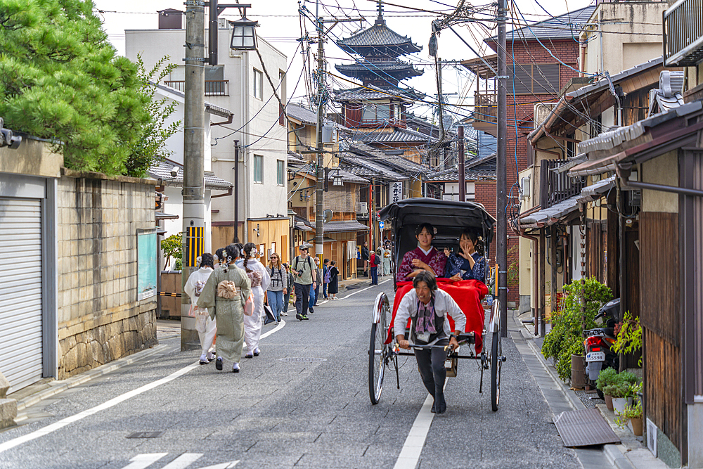 View of ladies in Kimonos and rickshaw in Gion, Kyoto Geisha District, Kyoto, Honshu, Japan