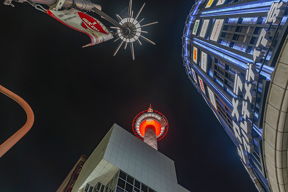 View of Nidec Kyoto Tower and nearby buildings at night, Shimogyo Ward, Higashishiokoji Kamadonocho, Kyoto, Honshu, Japan