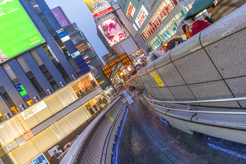 View of colourful adverts in Dotonbori, vibrant entertainment district near the river at dusk, Osaka, Honshu, Japan