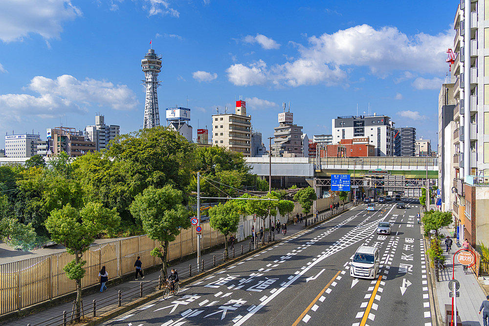 View of Tsutenkaku Tower and city skyline on a sunny day in the Shinsekai area, Osaka, Honshu, Japan