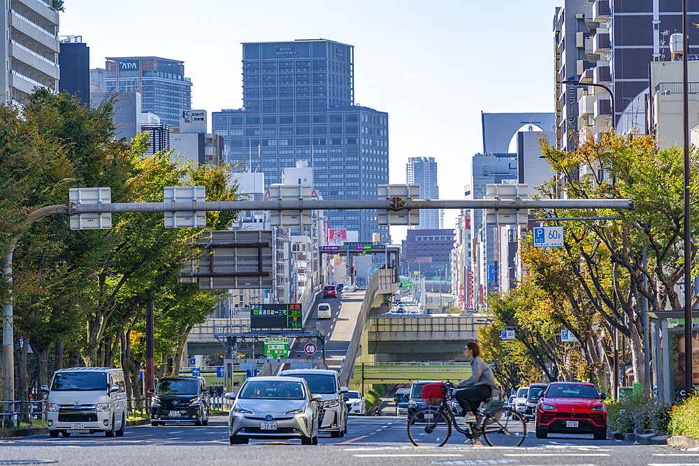 View of traffic and city skyline on Route 30 on a sunny day, Shitennoji, Tennoji Ward, Osaka, Honshu, Japan, Asia