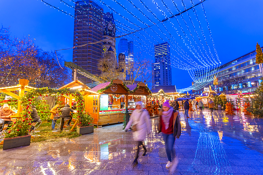 View of Kaiser Wilhelm Memorial Church and market stalls at Christmas, Breitscheidplatz, Berlin, Germany, Europe