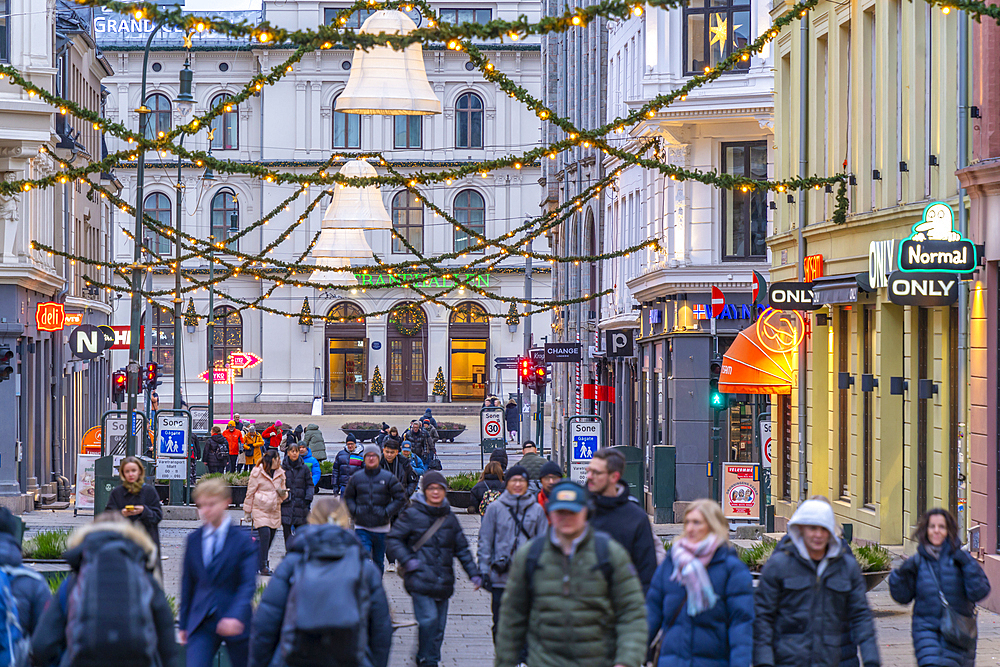 View of Christmas decorations and Oslo Central Station on Karl Johans Gate at dusk, Oslo, Norway, Scandinavia, Europe