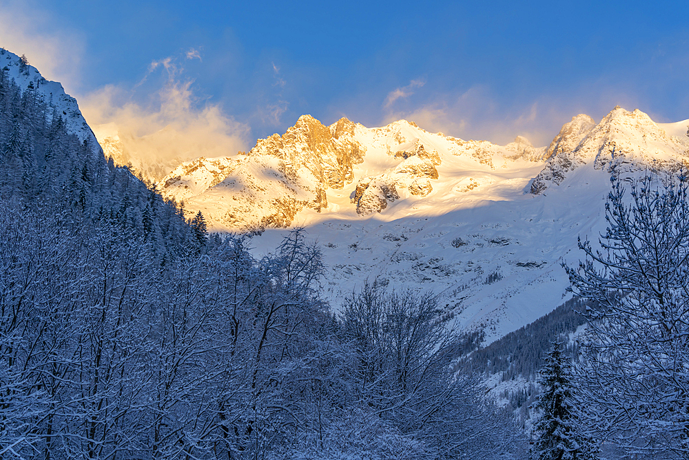 View of snow covered mountains from Courmayeur at sunrise during winter, Courmayeur, Aosta Valley, Italy, Europe