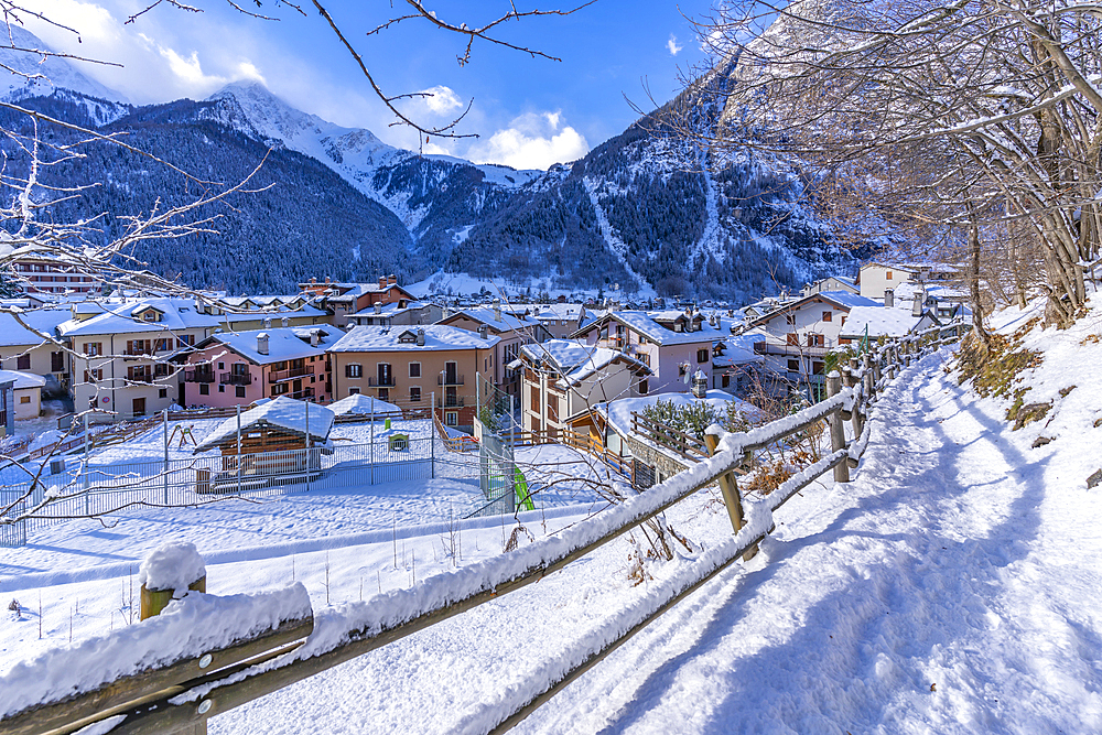 View of snow covered mountains and rooftops in Courmayeur during winter, Courmayeur, Aosta Valley, Italy, Europe