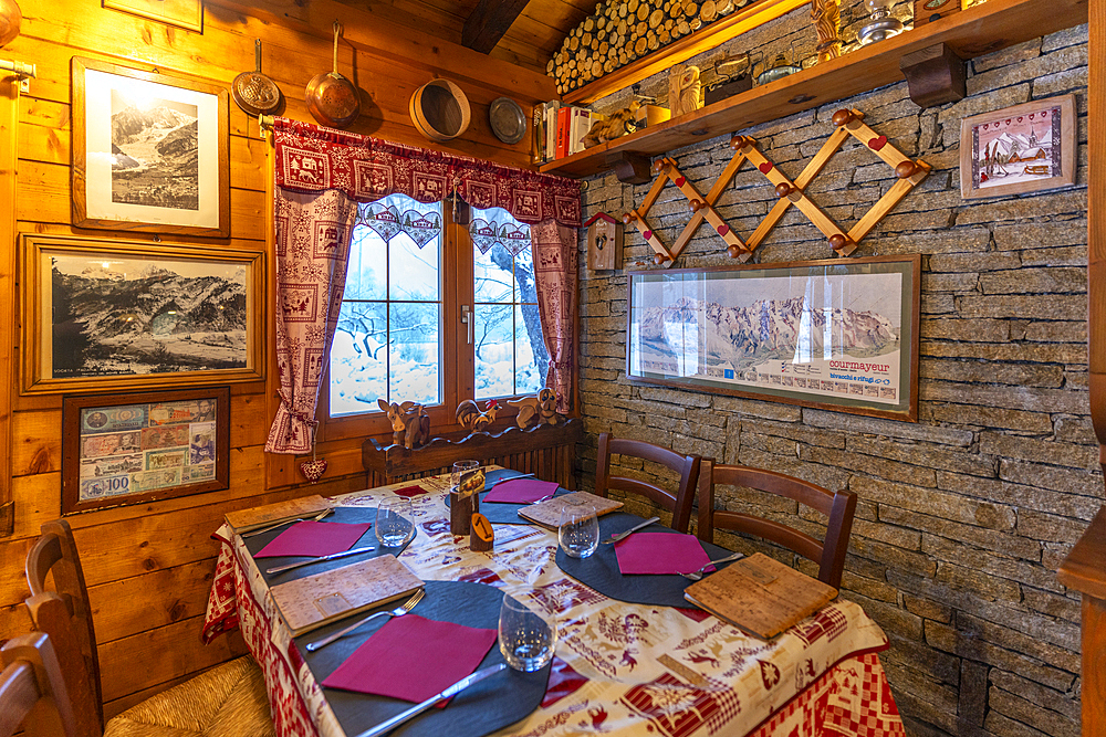 Interior view of typical wooden chalet cafe in Entrèves during winter, Entrèves, Aosta Valley, Italy, Europe