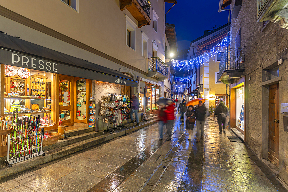 View of shops in town centre on Via Roma in Courmayeur during winter, Courmayeur, Aosta Valley, Italy, Europe