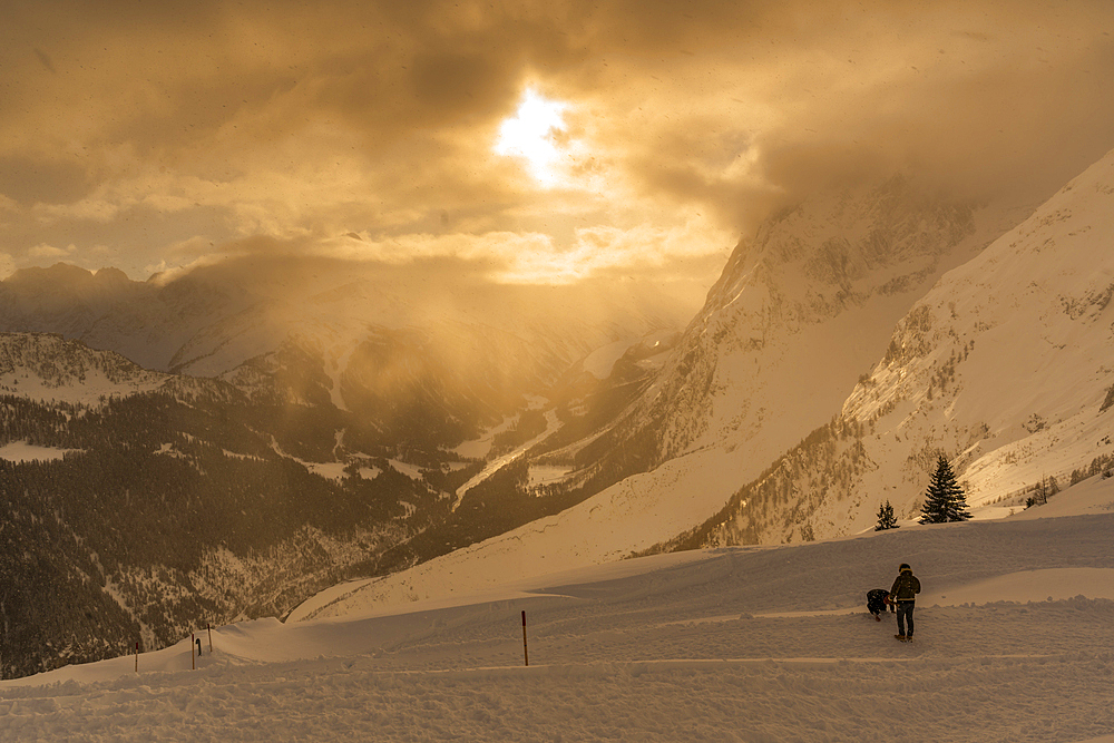 View of snow covered Aosta Valley and mountains from Pavillon du Mont Fréty in winter, Courmayeur, Aosta Valley, Italy, Europe