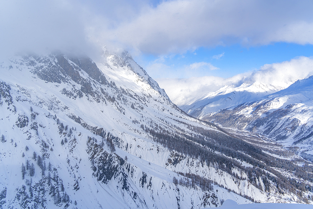 View of snow covered Aosta Valley and mountains from Pavillon du Mont Fréty in winter, Courmayeur, Aosta Valley, Italy, Europe