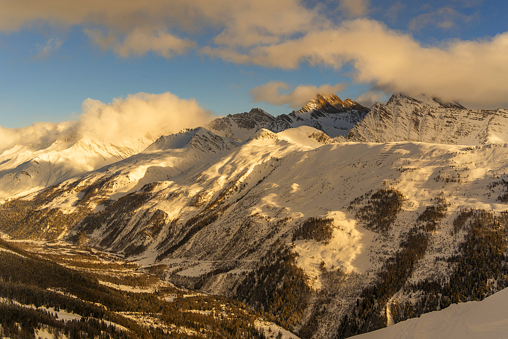 View of snow covered Aosta Valley and mountains from Pavillon du Mont Fréty in winter, Courmayeur, Aosta Valley, Italy, Europe