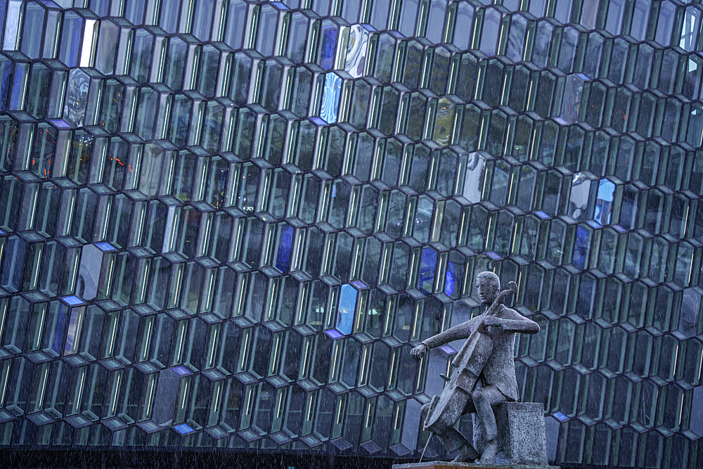 View of Sellóspilarinn statue and the Harpa Concert Hall and Conference Centre, Reykjavík, Iceland, Europe