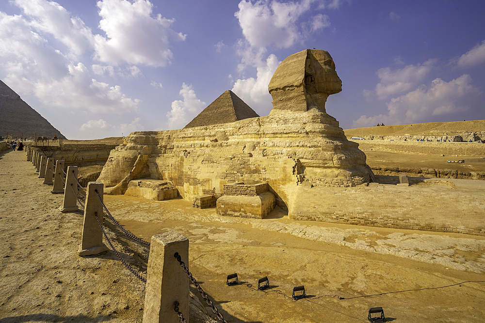 View of the Sphinx at the Pyramids of Giza on a sunny day, Giza, Cairo, Egypt, Africa