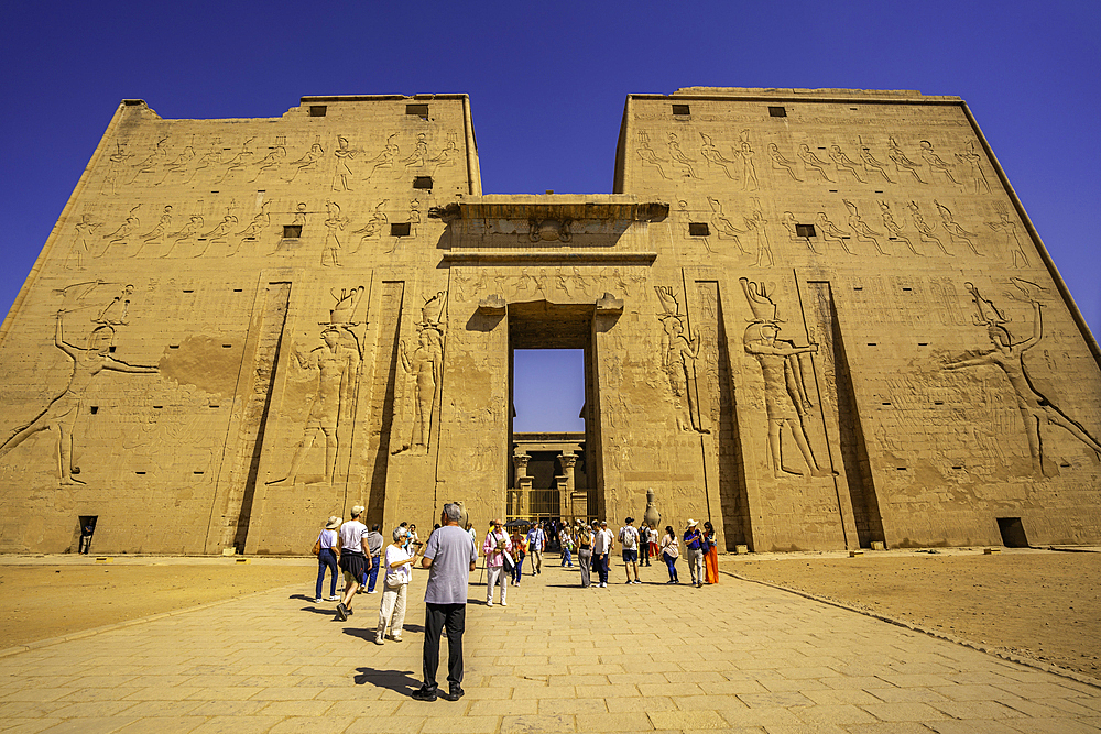 View of visitors at the Temple of Horus on a sunny day, Edfu, Egypt, North Africa, Africa